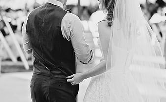 Bride and Groom Holding Hands at Outdoor Wedding Ceremony