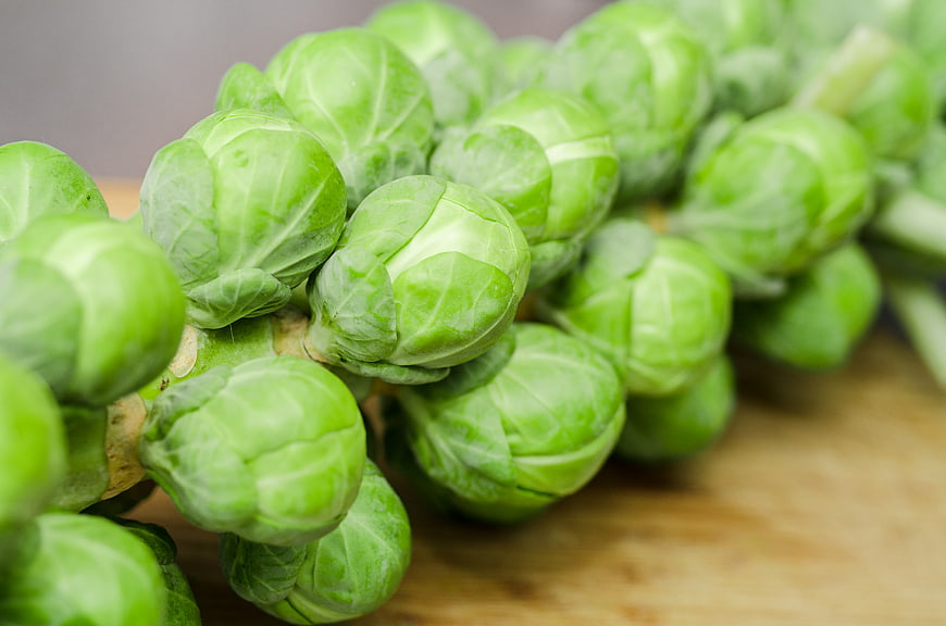 Fresh Brussels Sprouts on Wooden Cutting Board