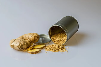 Fresh Ginger Root and Powder Spill from Tin