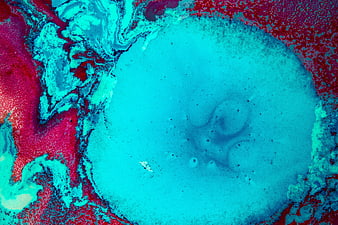Abstract fluid art background with vibrant red and cyan paint swirls