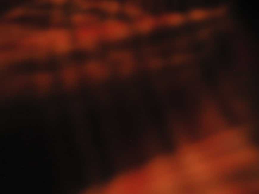 Abstract Dark Red and Orange Blurred Background