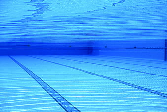 Underwater view of empty swimming pool with lane lines