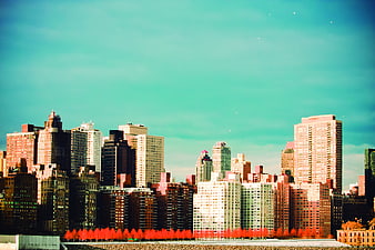 Vibrant Teal and Orange Cityscape Skyline with Red Trees