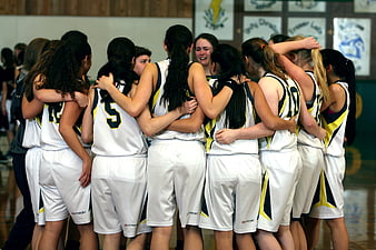 Girls Basketball Team Huddle in Gymnasium