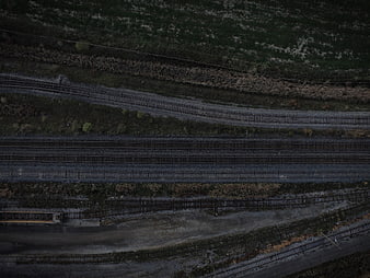 Aerial view of multiple railway tracks through green landscape