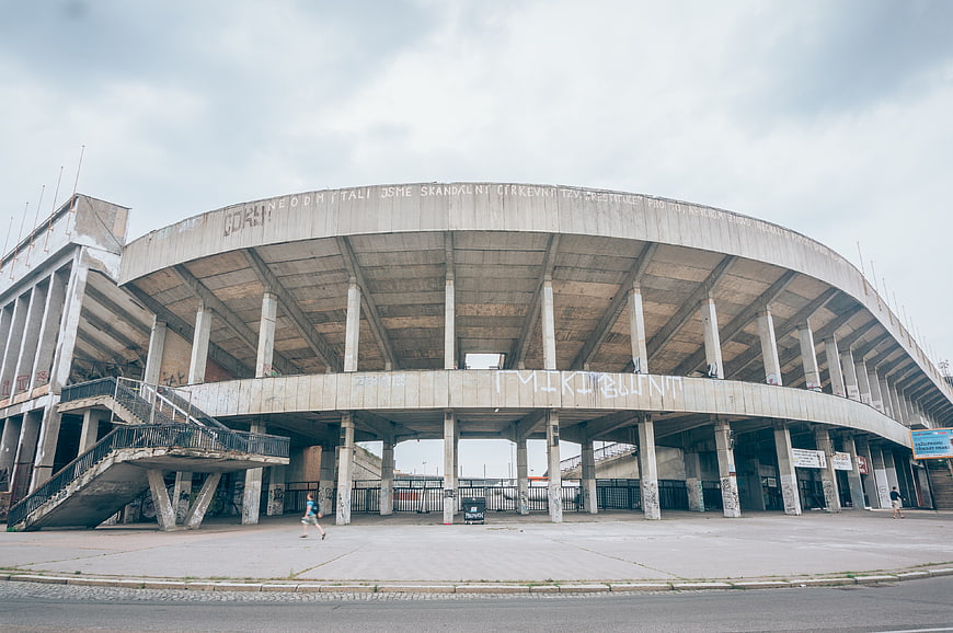 Wide angle view of abandoned brutalist concrete stadium architecture