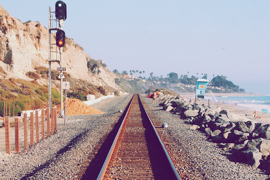 Railroad Tracks Leading to Pacific Beach with Cliffs