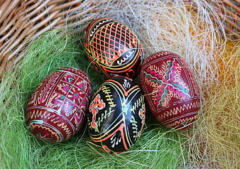 Traditional Easter Eggs in Wicker Basket with Moss