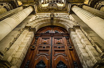 Low Angle View of Ornate Cathedral Wooden Doors