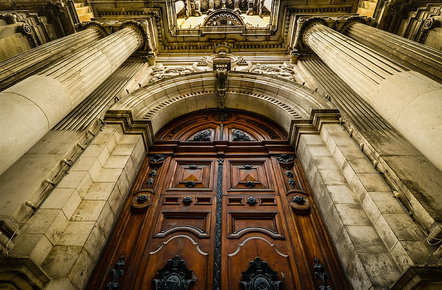 Low Angle View of Ornate Cathedral Wooden Doors