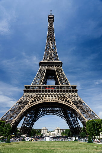 Low angle view of Eiffel Tower against blue sky