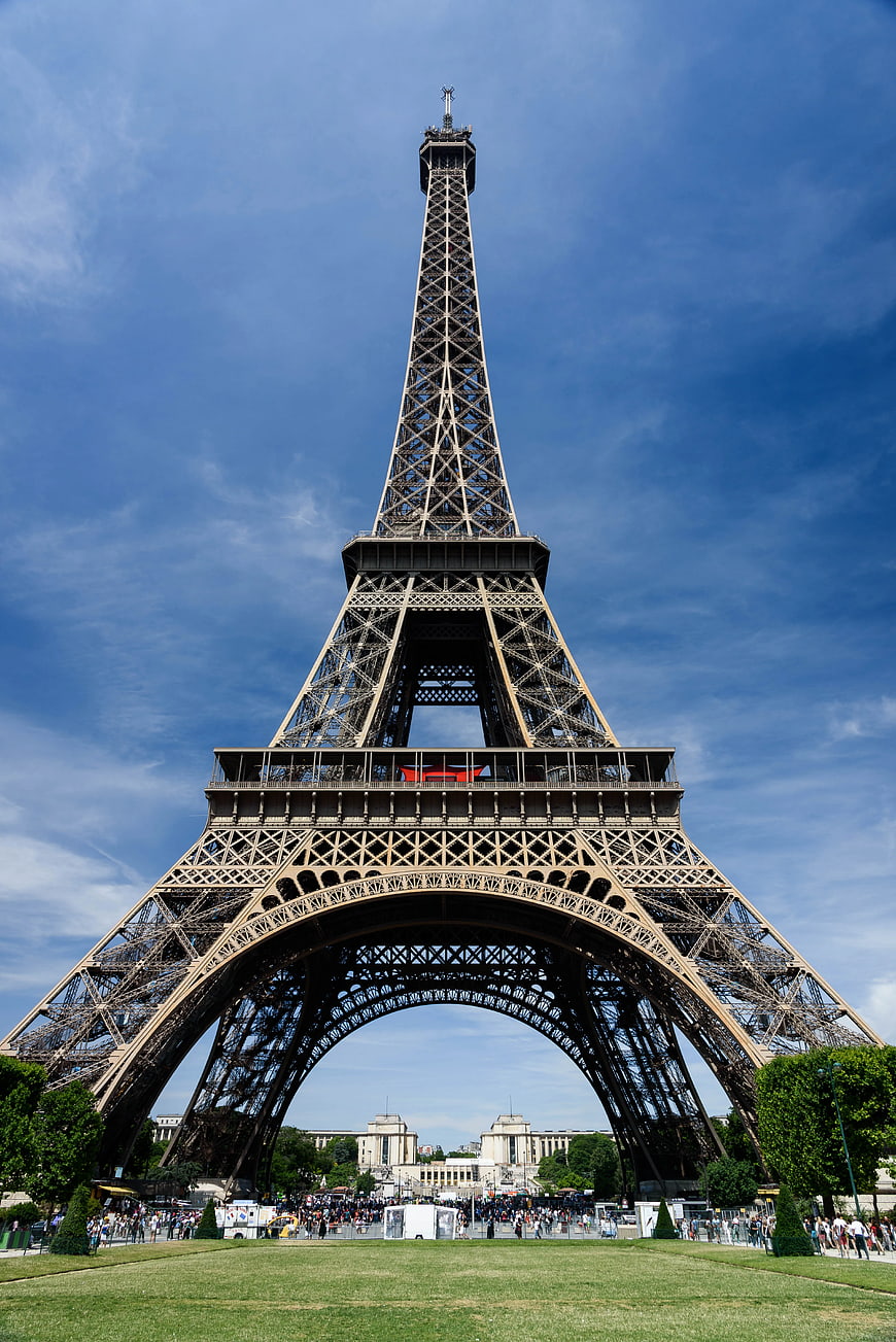 Low angle view of Eiffel Tower against blue sky