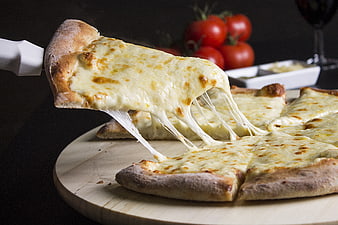 Cheesy Pizza Slice Being Lifted with Melted Mozzarella