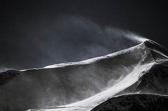 Dramatic Black and White Snowy Mountain Peak in Storm