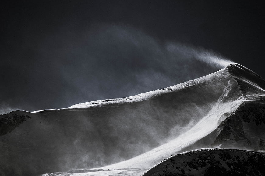 Dramatic Black and White Snowy Mountain Peak in Storm