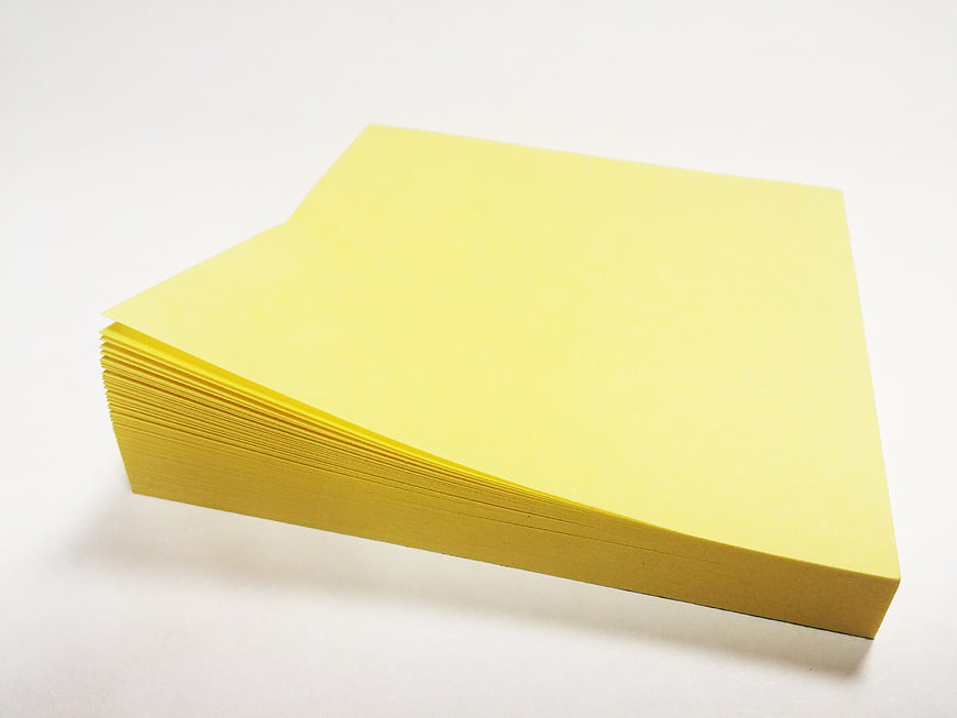 Stack of Yellow Sticky Notes on White Background