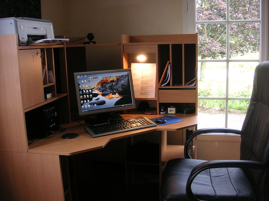 Home Office Workspace with Computer Desk and Window