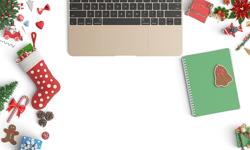 Christmas Flat Lay Workspace With Laptop, Stocking, And Holiday Decorations