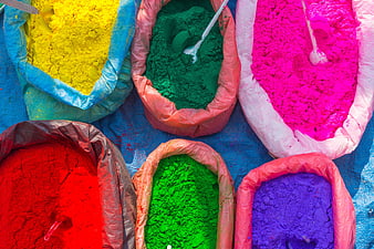 Vibrant Holi Color Powders in Open Bags