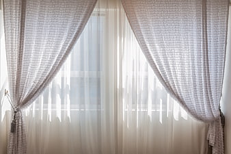 White Sheer Curtains And Textured Drapes In Bright Window