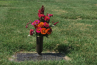 Floral Memorial Arrangement On Cemetery Gravestone