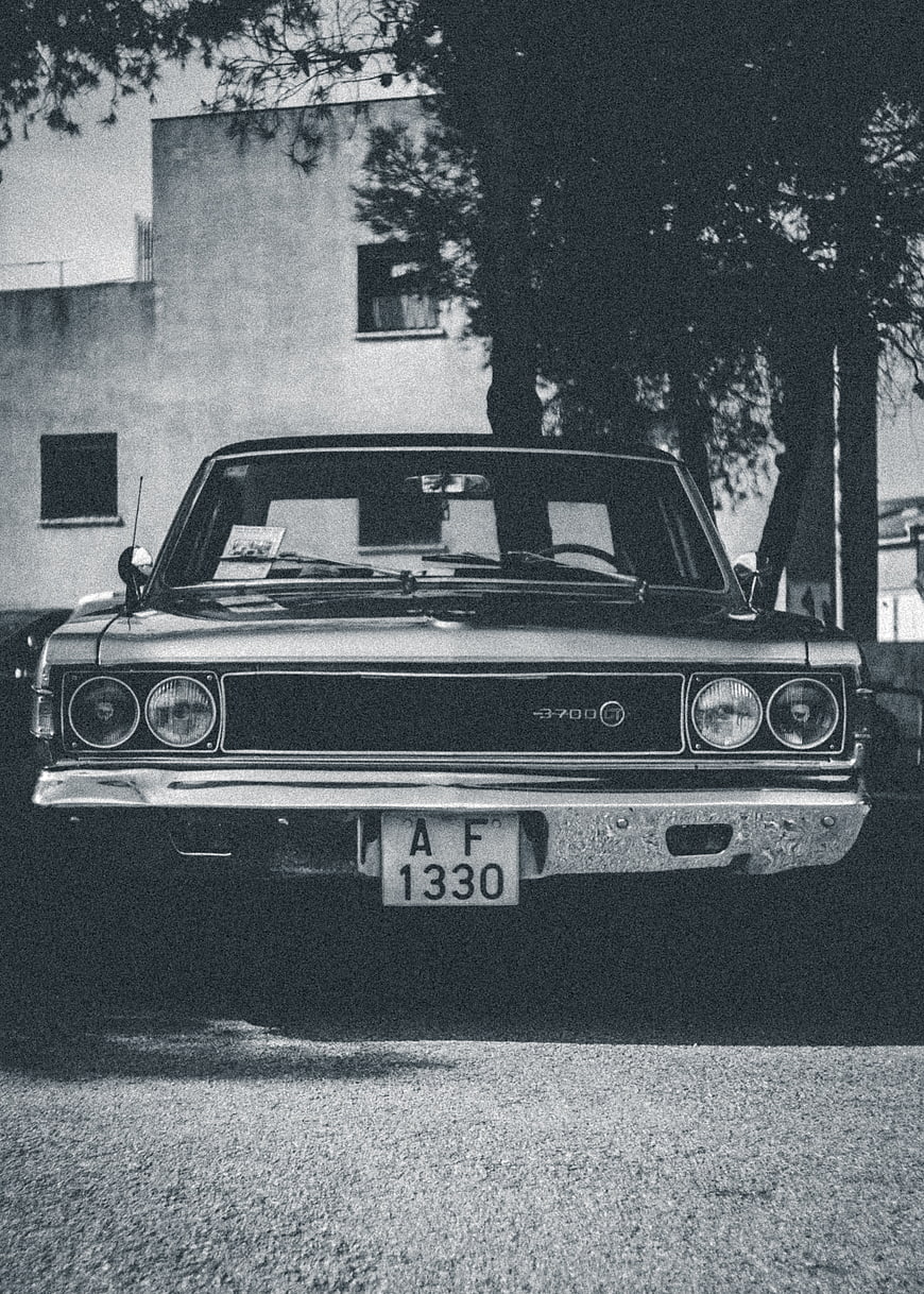 Vintage black and white photo of a classic car front view