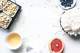 Top View of Healthy Breakfast with Tea, Nuts, and Fruit