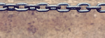 Rusty metal chain links with large blurred background copyspace