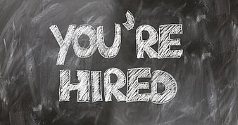 You're Hired Chalkboard Text for Employment and Job Success