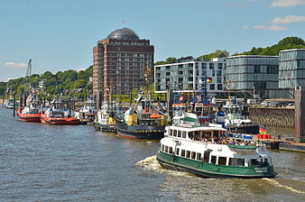 Hamburg harbor with Elbe river boats and modern architecture