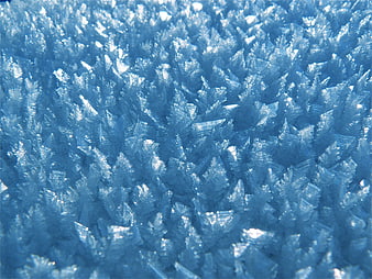 Close-up of blue ice crystals and hoarfrost texture
