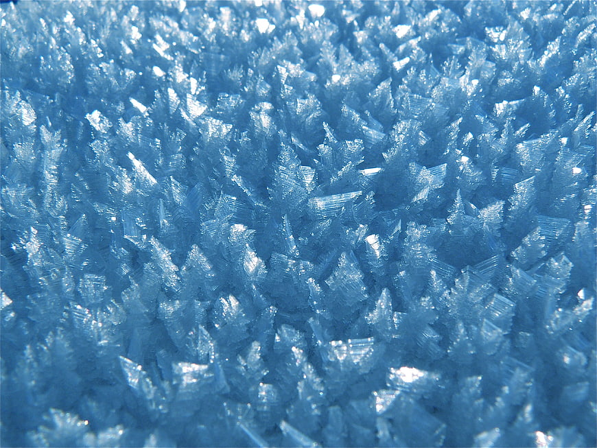 Close-up of blue ice crystals and hoarfrost texture