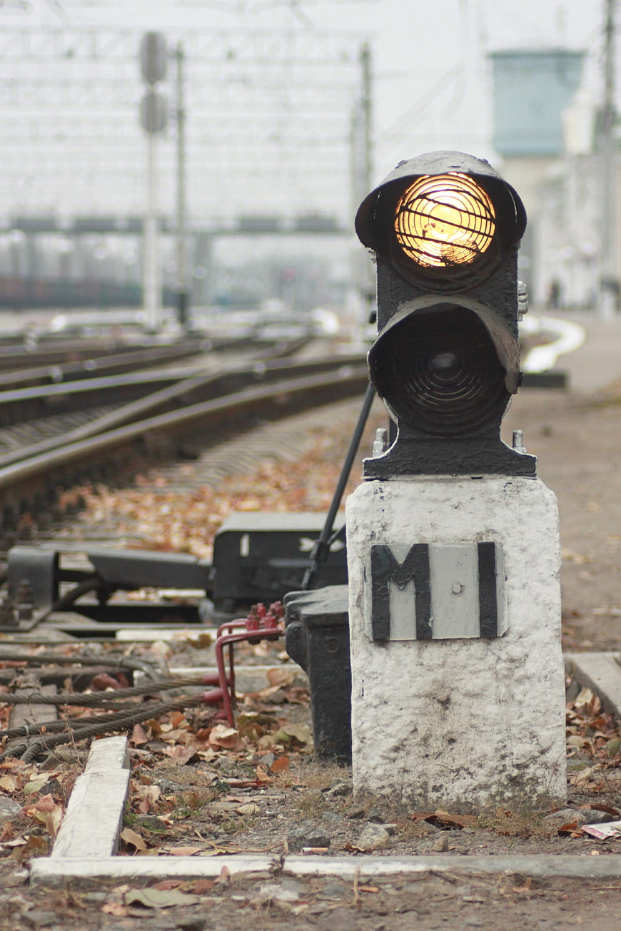 Close-up of railway signal light on tracks
