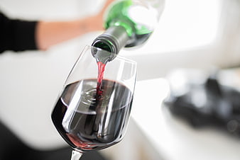 Pouring Red Wine into a Glass Close-Up
