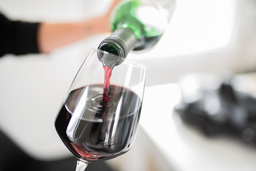 Pouring Red Wine into a Glass Close-Up