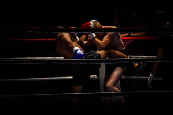 Dark Kickboxing Match in Ring with Ropes