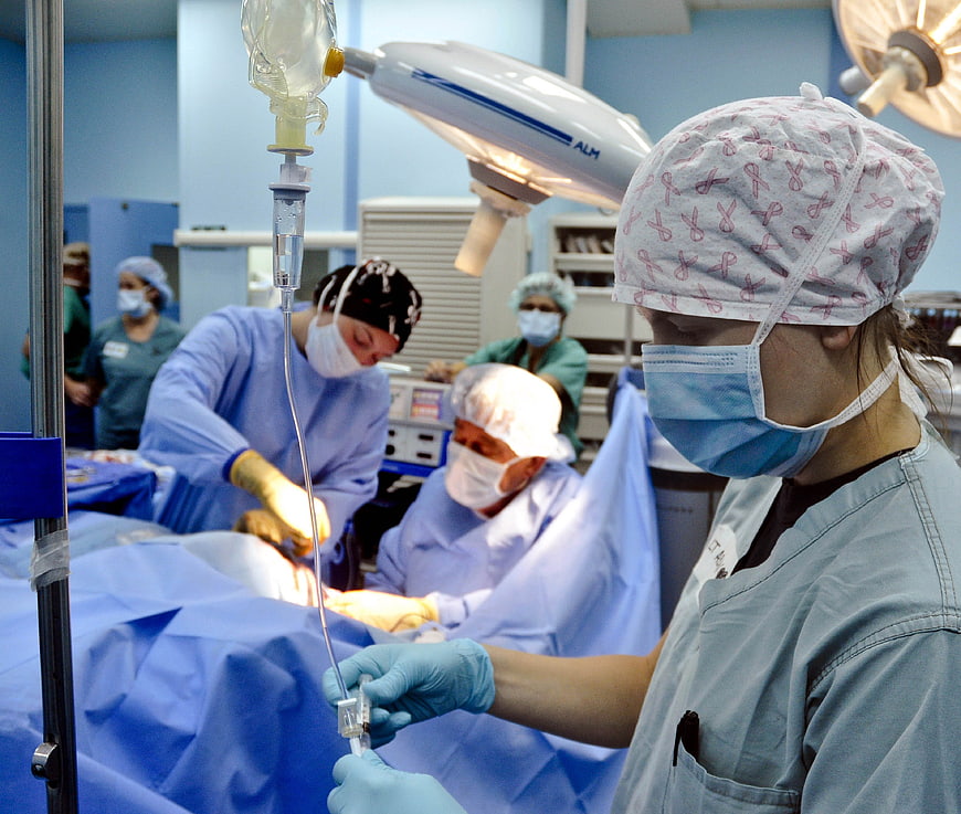 Surgical team performing operation in hospital operating room