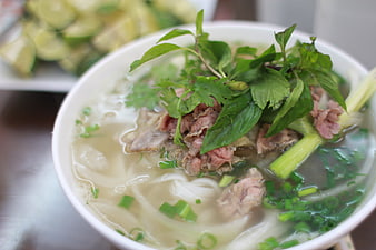 Vietnamese Beef Pho Noodle Soup With Fresh Herbs And Lime
