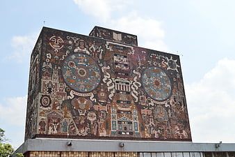 Large Mural on Building Facade with Cultural and Historical Motifs