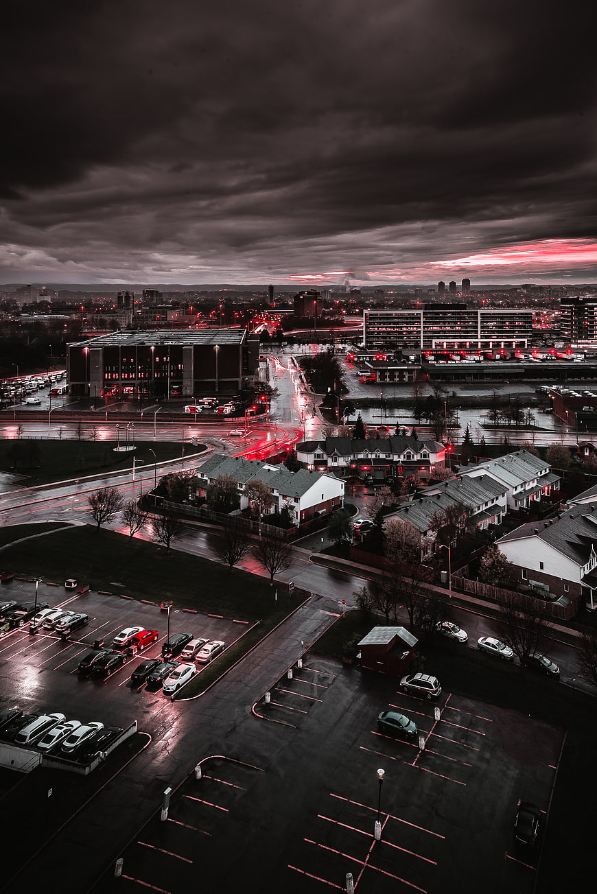 Dramatic Urban Cityscape at Dusk with Red Light Trails