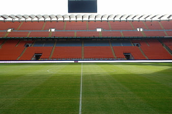Empty San Siro Stadium Pitch And Red Seating