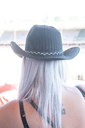 Back View of Woman with Silver Hair Wearing Black Cowboy Hat