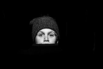 Dramatic black and white portrait of a boy in a beanie