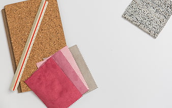 Interior design materials with fabric swatches and cork board