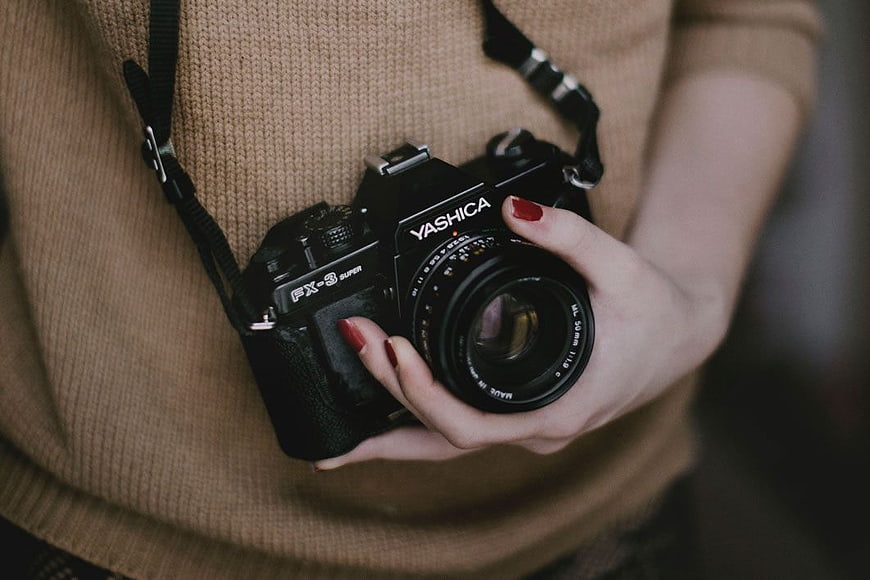 Woman Holding Vintage Yashica Film Camera