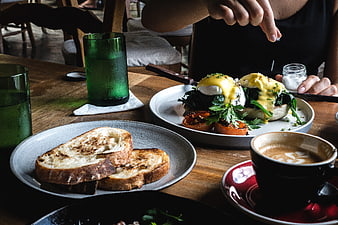 Brunch spread with eggs benedict, toast, and coffee