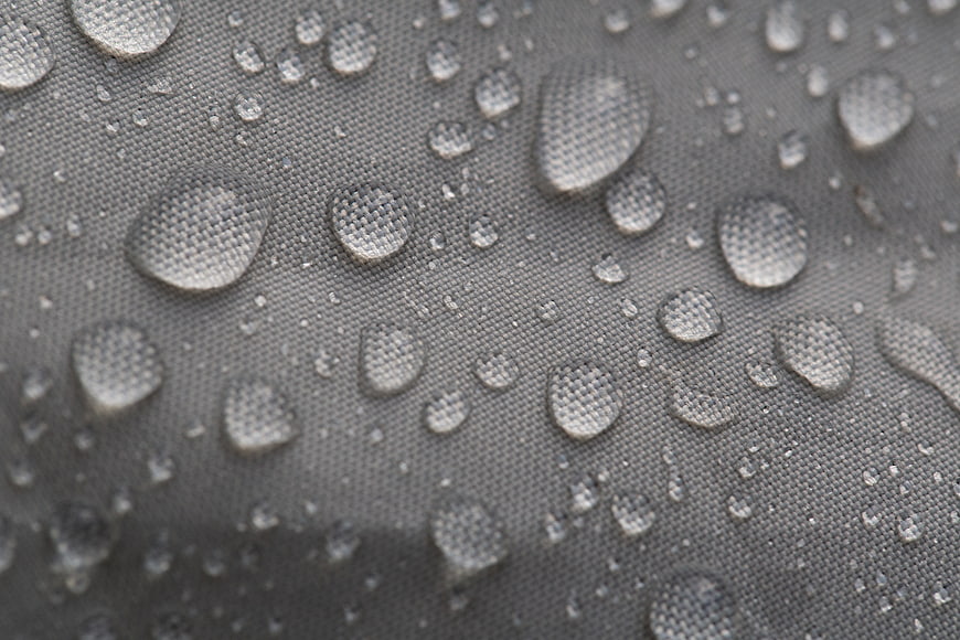 Macro Water Droplets on Gray Waterproof Fabric Texture