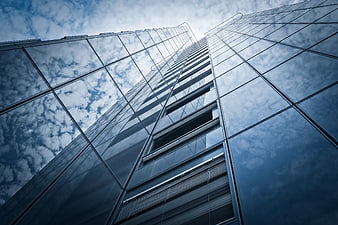 Modern Glass Skyscraper Facade Looking Up At Cloudy Sky