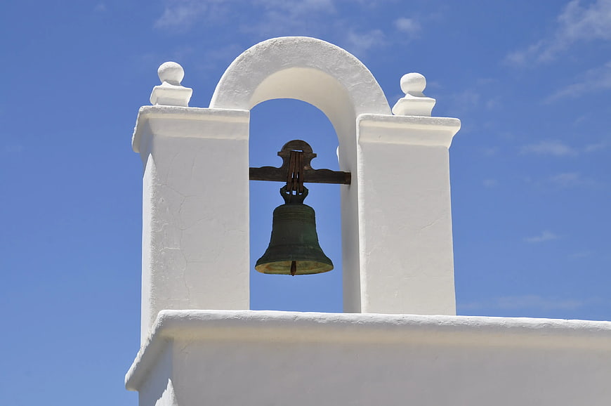 White Church Bell Tower Against Blue Sky