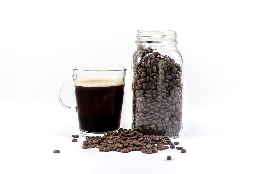 Fresh Brewed Coffee and Roasted Beans in Glass Jar